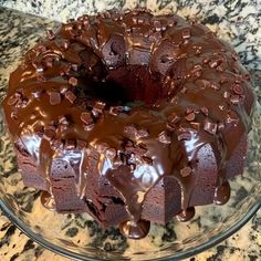 a chocolate bundt cake on a glass plate