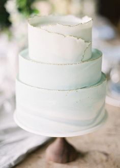 a three tiered cake sitting on top of a table