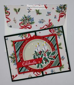 a christmas card with candles and holly on it, next to an envelope that says celebrate