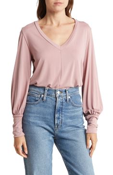 Smooth fabric makes this V-neck top a timeless staple for your style portfolio. V-neck Long sleeves 95% rayon, 5% spandex Machine wash, line dry Made in the USA of imported fabric V Neck Blouse, Nordstrom Store, Solid Tops, V Neck Tops, Pure Cotton, Nordstrom Rack, Shirt Blouses, Top Blouse, Nordstrom