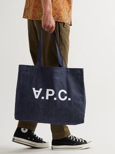 A.P.C.'s tote bag is made from sturdy denim that'll hold both weekly groceries and lighter cargo with ease. It's printed with a flipped version of the brand's initials and has an internal pocket to keep your wallet, keys and phone within easy reach. Cargo Tote Bag, Apc Tote Bag, Reworked Bag, Bag Compartments, Apc Bag, Tote Bag Men, Tote Bag For Men, Porter Bag, Thrift Flip