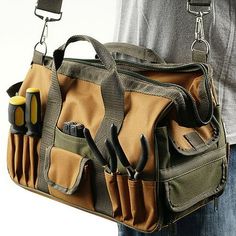 a man holding a tool bag with tools in it's pocket and hanging from his belt