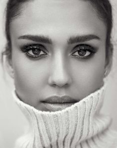 black and white photograph of a woman wearing a turtle neck sweater