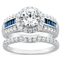 a diamond and blue sapphire engagement ring set with matching bands on the band, in 18k white gold