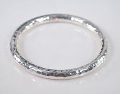 Large size sterling silver hammered round bangle bracelet is marked 925 Italy.  The hammered silver has a width of about 7.5mm or a little over 1/4 inch and the opening measures 3 full inches so this is a large wrist bangle.  The inside circumference is about 9.4 inches, and the weight of the bracelet is 19.8 grams.  It is in great vintage condition. Hammered Bangles, The Bangles, Hammered Silver, Bangle Bracelet, Bangle Bracelets, Jewelry Bracelets, Bangles, Bracelet, Sterling Silver