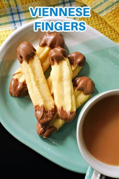 chocolate dipped french fries on a plate next to a cup of tea and napkins