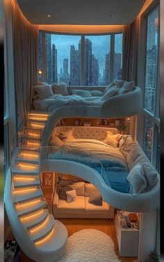 a bedroom with a spiral staircase leading up to the top floor and bed below it