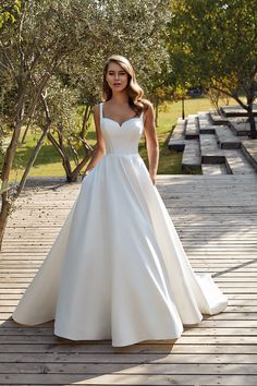 RILEY is a mikado ballgown with ivory matte lining, pockets, and buttons to the end of the train. Ballgown Wedding Dress Simple, Simple Timeless Wedding Dress, Minimalist Wedding Dress Elegant, Minimalist Wedding Gown, Mikado Wedding Dress, Timeless Bride, Mikado Fabric, Satin Bridal Gowns