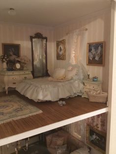 a doll house bedroom with furniture and accessories on the floor in front of a mirror