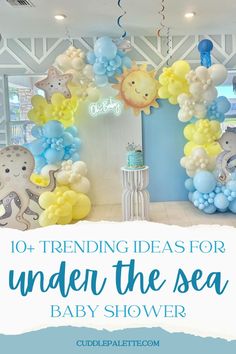 an under the sea baby shower with blue and yellow balloons on it, including elephants