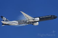 an air new zealand plane flying in the sky