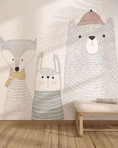 two bears with hats and scarfs are standing in front of a wall mural