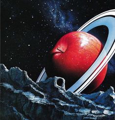 an apple is in the middle of a space scene with mountains, rocks and stars