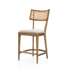 a wooden chair with a white seat and back rest on a white background in front of a white backdrop