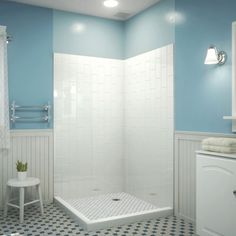 a blue and white bathroom with checkered floor tiles on the shower stall, toilet and sink