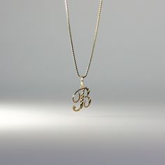 A timeless piece that will never go out of style. This 14K gold calligraphy pendant is the perfect and most stunning way of keeping a name close to your heart. We handmade each piece so you can assure you're getting a one-of-a-kind pendant that is not like any other. This 14K solid gold letter pendant is flawlessly crafted to look super chic and elegant around your neck. Pair it with a nice gold chain and wear it with almost all of your outfits. The piece is such a versatile lettering necklace. Elegant Yellow Gold Name Necklace With Box Chain, White Gold Engraved Initial Pendant Necklace, White Gold Engraved Pendant Initial Necklace, Engraved White Gold Initial Pendant Necklace, Hallmarked White Gold Initial Pendant Necklace, Yellow Gold Initial Pendant Necklace With Box Chain, Engraved Initial Pendant Name Necklace In Yellow Gold, Yellow Gold Initials Pendant Necklace, Yellow Gold Initial Pendant Necklace