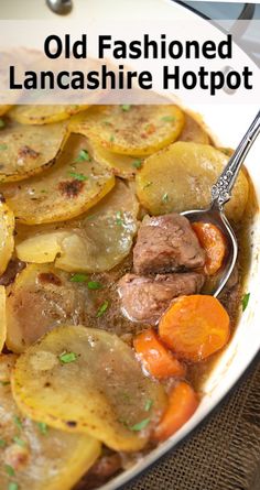 a white bowl filled with potatoes and meat