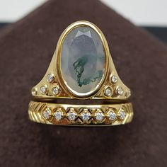 Moss Agate Oval Gemstone Ring | Wedding Couple Rings for Spring | Green House Design Gold Ring | Victorian Green Moss Stack Rings For Women Moss Agate Rings are gorgeous pop of color and unique one of a kind style rings. No two gemstones are same and is unique as yourself. Also these are pocket friendly than diamonds and encourage tranquility & emotional balance.  Detailed Description ------------------------------ Total ring 💍: 2 Total Diamonds 💎 : 16 Pcs Ring Specifications:  Gemstone Shape - Kite   💎 Weight & Size - 2.3 Ct - 12.20X8.20X4.30 MM (1 Pcs)  Diamond Shape - Round   💎 Weight & Size - 0.1 Ct - 1.30 MM (15 Pcs)   💎 Total Gemstones Weight - 2.41 Ct   💍  Total Weight of the Ring - 5.618 ◾ Type - Natural Diamond ◾ Clarity - VS-GH ◾ Luster - Excellent ◾ Make - High Quality ◾ T Ring Wedding Couple, Wedding Couple Rings, Victorian Green, Agate Rings, Green House Design, Stack Rings, Headpiece Jewelry, Moss Agate Ring, Stack Ring