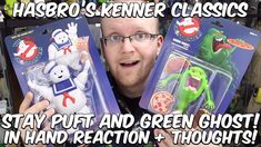 a man holding two toy figures in front of his face with the caption harro - skeener classics stay puft and green ghost in hand reaction