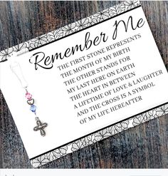 a card with a cross on it that says, remember me the first stone represents the month of my birth