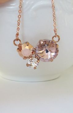 "The necklace was designed with a 12mm round Vintage Rose crystal, 8mm round Rose Gold crystal, and a 6mm round Clear crystal. I have hand set each crystal in a prong rose gold plated setting. The chain is rose gold plated. Choose from a 15\" - 18\" chain length at checkout. To view more items from my shop, please click the link below. http://www.etsy.com/shop/Uniquebeadables Don't forget to like \"UNIQUEBEADABLES\" on FACEBOOK to make sure that you receive all my promotions, and new items! Than Blush Necklace, Blush Jewelry, Wedding Earrings Chandelier, Blush Earrings, Pink Crystal Earrings, Lavender Earrings, Crystal Earrings Wedding, Rose Crystal, Necklace Swarovski