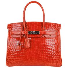 Mightychic offers a Niloticus Crocodile Hermes Birkin 30 bag featured in Orange. Fresh palladium hardware accentuates this gorgeous orange crocodile Hermes bag. Carried 1 time only. Immaculate condition interior and exterior. This exotic Niloticus crocodile skin bag is a magnificent addition to any Hermes handbag collection. Comes with the lock and keys in the clochette, sleepers and raincoat. VERY LIKE NEW. Receive outstanding service and a seamless shopping experience with mightychic as your Hermes Birkin online store. final sale BAG MEASURES: LENGTH 30cm / 12" TALL 21cm / 8.5" DEEP 15cm / 6" HANDLES: TALL 4" CONDITION: Very Like New Hermes Crocodile Bag, Jane Birkin Basket, Christian Dior Bag, Hermes Birkin 35, Limited Edition Bag, Birkin 30, Crocodile Bags, Hermes Birkin 30, Jane Birkin