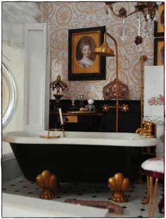 an old fashioned bathtub in the corner of a room with a painting on the wall