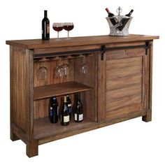 a wooden cabinet with wine glasses and bottles