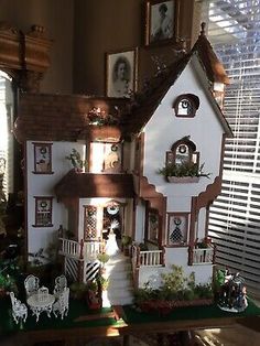 a doll house sitting on top of a table