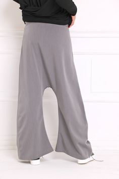 Women Harem Pants, Gray Pants, Drop Crotch Pants Drop crotch sweatpants in wide leg: |KONGO| GARMENT FEATURES: * Clean, minimalistic design * Very low drop crotch silhouette * Wide leg fit * Elasticated * Practical, in-seam side pockets * Made from quality soft sweatshirt jersey COLOUR OPTIONS: This product is available in the following colour options: - black; - ecru; - graphite grey; - light grey; - royal blue. SIZE & FIT: Model is 175cm tall and wears size S. COMPOSITION: Main: 100% cotto Solid Baggy Wide Leg Parachute Pants, Solid Color Baggy Wide Leg Parachute Pants, Gray Baggy Pants With Elastic Waistband, Oversized Solid Ankle-length Bottoms, Oversized Ankle-length Pants, Baggy Full-length Harem Pants For Loungewear, Baggy Solid Yoga Pants For Spring, Oversized Wide Leg Solid Color Pants, Oversized Solid Wide Leg Pants