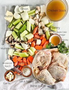 the ingredients for chicken stock on a cutting board