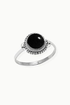 Sanskrit for divine, Divya symbolizes the life energy within us which connects to the divine energy of the universe. Our Divya ring is handcrafted in fine sterling silver, with signature textured detailing and an authentic large solitaire gemstone as a centerpiece, adding sophistication to your everyday look. Authentic Sivalya Black Onyx Hallmarked Metal: 925 Sterling Silver Gemstone Size: 10mm x 10mm Cut: Round Shaped Smooth Cabochon Black Onyx: Endurance, Perseverance, Grounding Elegant Silver Stackable Rings With Natural Stones, Black Spiritual Round Rings, Spiritual Onyx Ring Jewelry, Spiritual Black Rings, Life Energy, Divine Energy, Sanskrit, Jewelry Cleaner, The Divine