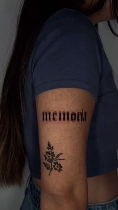 a woman with a tattoo on her arm that says,'mennona '