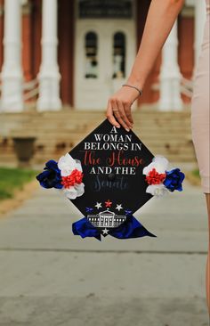 a woman holding a graduation cap with the words, you are belong in the heart and the spirit