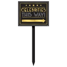 a sign that says celebrate this way with an arrow pointing to the right and stars on it