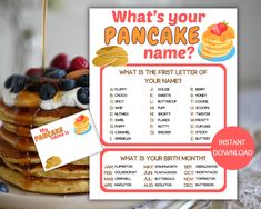 pancakes with blueberries and raspberries are on a plate next to a sign that says, what's your pancake name?