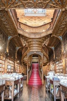 the inside of an old library with red carpet