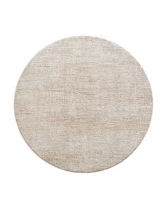 a round rug with an oval design on the top and bottom, in neutral colors