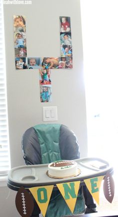 a baby's high chair in front of a table with football decorations on it