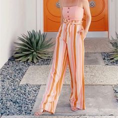 Forever 21 Striped Paper Bag Wide Leg Pants Brand New (No Tags). Colors: Pink, Burnt Orange, Orange & White. Size: X-Small Material: 100% Rayon They Are Quite Long. I’m 5’3 & They Were Just Too Long So I Recommend Around At Least 5’5 To 5’9 Should Fit Best. Also I Apologize For How Wrinkled They Are, Don’t Have An Iron Currently Chic Pink Pants For Vacation, Pink High-waisted Vacation Pants, Pink Cotton Pants For Vacation, Pink Summer Pants For Day Out, Summer High Waist Pink Pants, High Waist Pink Pants For Beach, Pink High Waist Summer Pants, Trendy Pink Pants For The Beach, Trendy Pink Pants For Beach