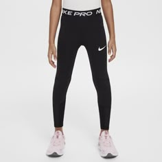 the nike pro leggings are black and white, with pink accents on the side