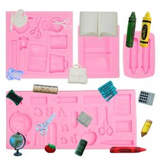 pink play set with various items including scissors, crayons and other crafting supplies