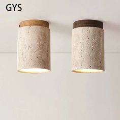 two concrete lamps hanging from the ceiling