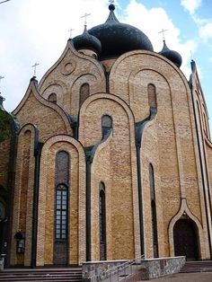 an old church with many windows and arches