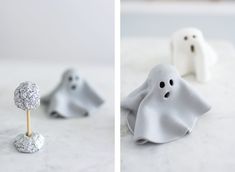 there are two small white ghost candies on the table