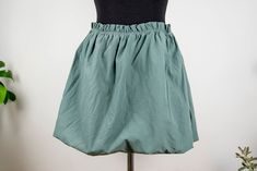 Vintage sage green bubble mini skirt in mint condition. Seems handmade Shell feels cotton polyester blend Lining feels like cotton spandex blend Fits like women size M/L waist 34 cm = 13.4 inches hips open length 42 cm = 16.5 inches Vintage Sage Green, Green Bubble, Green Mini Skirt, Hip Openers, Slovenia, Cotton Spandex, Sage Green, Mint Condition, Mini Skirt