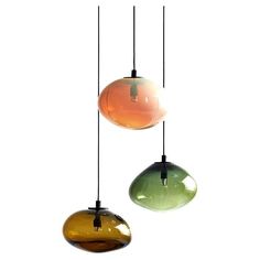 three different colored lights hanging from the ceiling