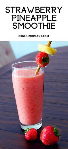 a strawberry pineapple smoothie in a glass with strawberries on the side and text overlay