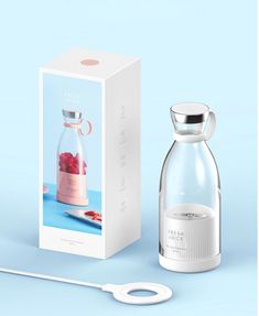 a glass bottle with strawberries in it next to a white box and an electric toothbrush