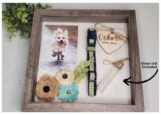 a wooden frame with some pictures and flowers on it, including a dog's leash